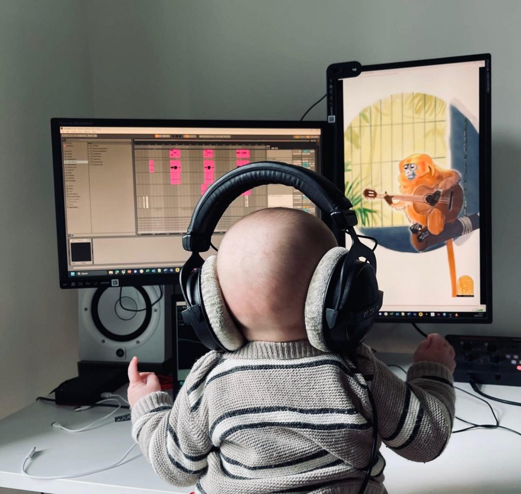 The B. giving the master one final listen before sharing it with the rest of the team